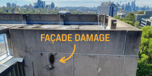 An example of a damaged concrete facade found on a high rise building in Sydney. Large yellow text reads 'FACADE DAMAGE'